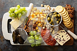 Cheese and snacks platter overhead shot