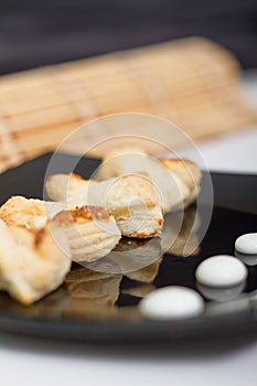 Cheese snacks served in black plate