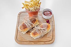Cheese Steak sandwich with french fries and tomato sauce served in a dish isolated on grey background top view