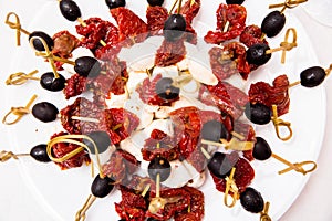 Cheese, sun dried tomato and olives on skewers