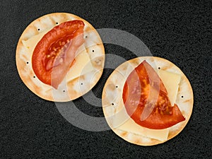 Cheese and Tomato on Water Biscuit Crackers