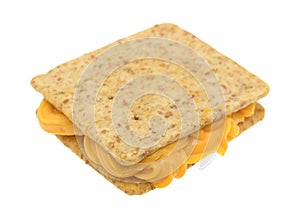 Cheese between two crackers on a white background