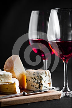 Cheese and two glasses of red wine