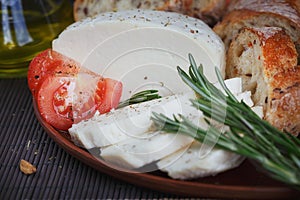 Cheese, vegetables, herbs, olive oil and bread