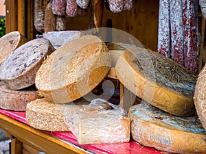 Cheese wheels on open air market stall