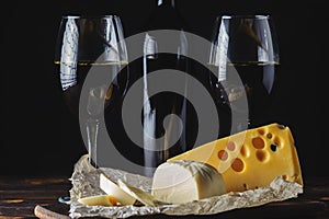 Cheese wine in glasses on a black background