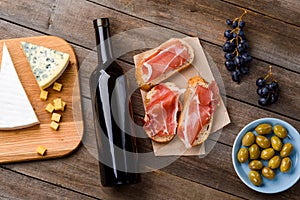 Cheese, wine, meat and fruits