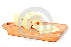 Cheese on wooden kitchen board