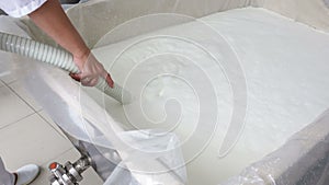 Cheese worker hands creamery dairy milk pour