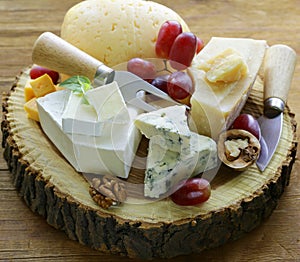 Cheeseboard with assorted cheeses photo