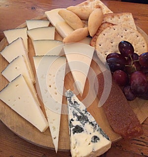 Cheeseboard with biscuits and grapes