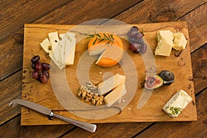 Cheeseboard with fruit and herbs