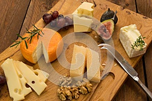 Cheeseboard with fruit and herbs