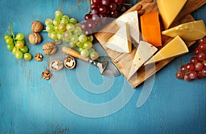 Cheeseboard, grape and nuts photo