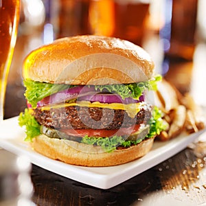 Cheeseburger with beer and french fries