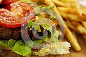 Cheeseburger on the board with french fries