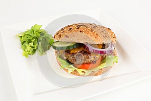 Cheeseburger with cucumber and tomato