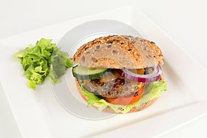 Cheeseburger with cucumber and tomato