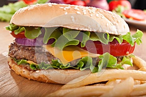 Cheeseburger and french fries with ingredients