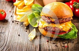 Cheeseburger with fresh salad and french fries