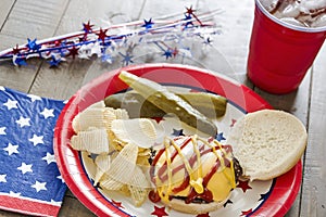 Cheeseburger with ketchup and mustard at a patriotic themed cookout
