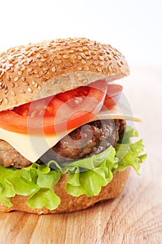 Cheeseburger with tomatoes and lettuce