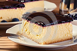 Cheesecak with blueberries and a cap of coffee