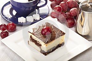 Cheesecak with a cap of coffee