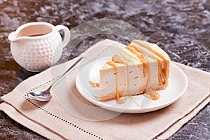 Cheesecake with caramel drizzle, served on plate