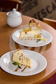 Cheesecake with caramel on the table