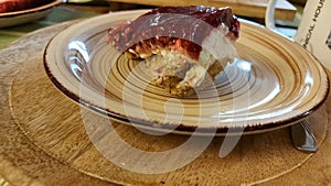 Cheesecake on the ceramic plate. Food and drink in close-up.