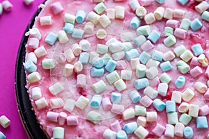 Cheesecake with Marshmallows for Birthday Party on Pink Background