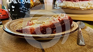 Cheesecake slice on the Ceramic plate. Macro photo of fruit torte.