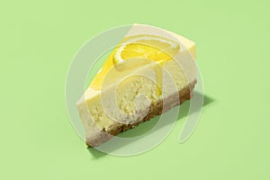 Cheesecake slice with lemon syrup topping. Slice of cheesecake close-up