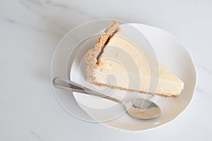 Cheesecake slice on white plate
