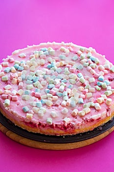 Cheesecake with Small Marshmallows for Party on Pink Background
