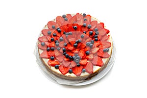 Cheesecake with strawberries and blueberries, isolated on white