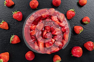 cheesecake with strawberry and fresh berries on black background