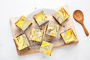 cheesecake swirl brownies on a marble countertop
