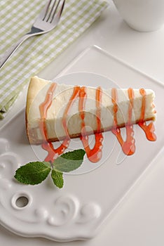 Cheesecake under strawberry sauce