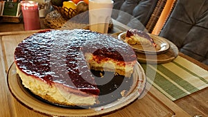 Cheesecake on the wooden table. Close-up photo of torte.