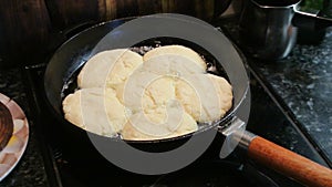 Cheesecakes round shape fried in a cast iron skillet