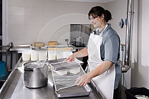 Cheesemaker prepares the tools to make cheese