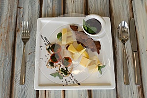 Cheeseplate with souce on a table