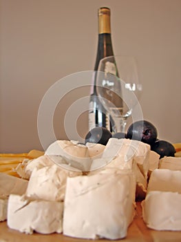 Cheeses plate and bottle of wine