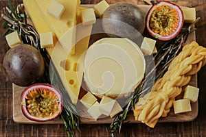 cheeses, rosemary and passion fruit.milk fat and Milk products.Cheese platter with fruits. Cheese board set. assorted