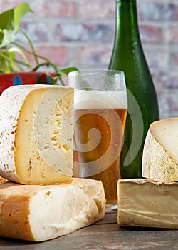 Cheeses and Tomme de Savoie with beer, French cheese Savoy, french Alps France