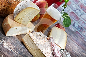 Cheeses and Tomme de Savoie with beer, French cheese Savoy, french Alps France