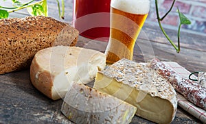 Cheeses and Tomme de Savoie with beer, French cheese Savoy, french Alps France