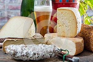 Cheeses and Tomme de Savoie with beer, French cheese Savoy, french Alps France